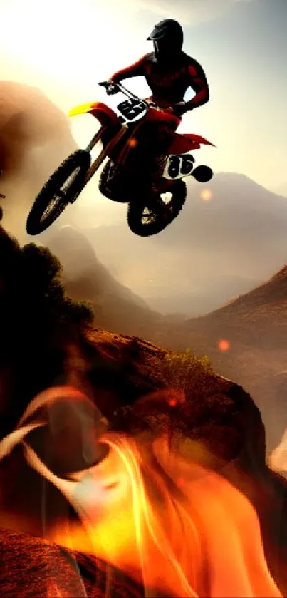 Motocross rider jumps over desert landscape at sunset.