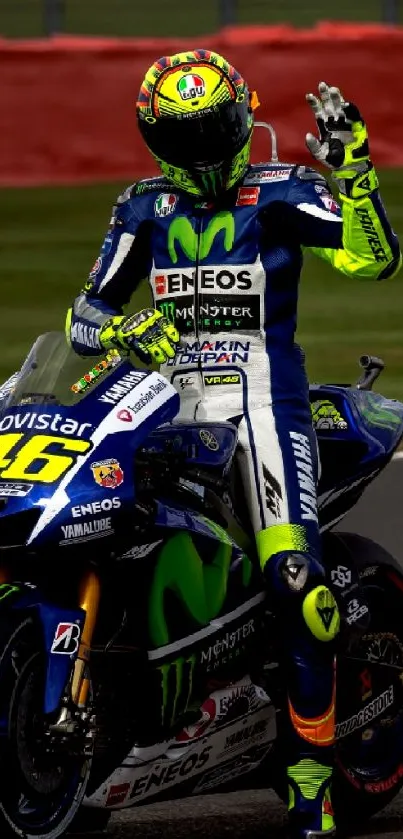 Motorcycle racer on track with blue gear and helmet.