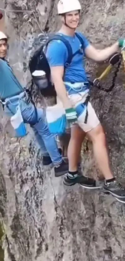 Two climbers scale a rocky cliff with determination.