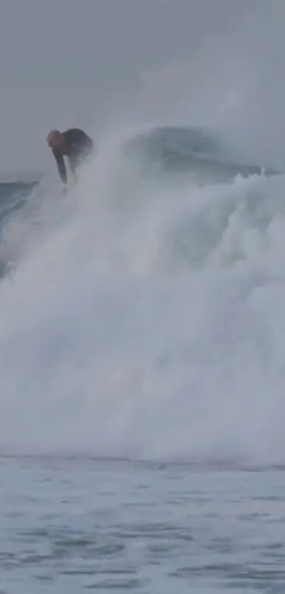 Surfer riding a large wave, creating an exciting ocean scene.