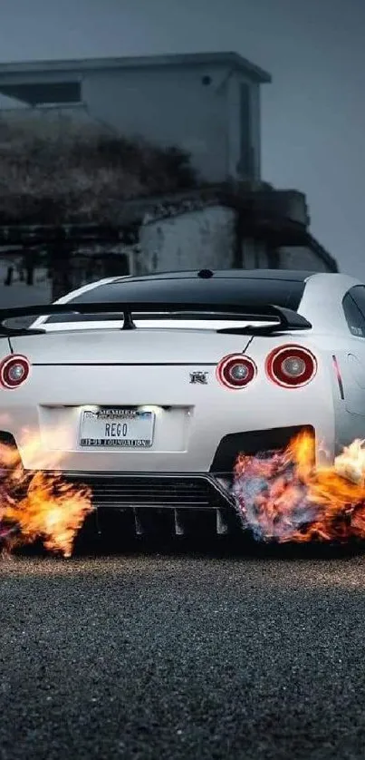 White sports car with fiery exhaust at night, dark blue background.