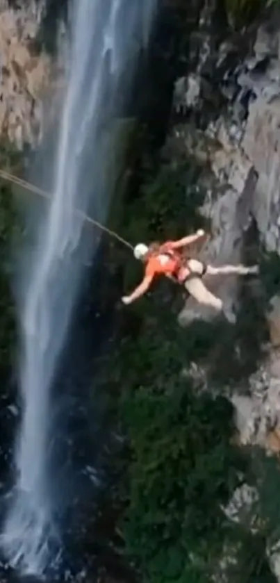 Person cliff jumping by a waterfall in a stunning natural scene.