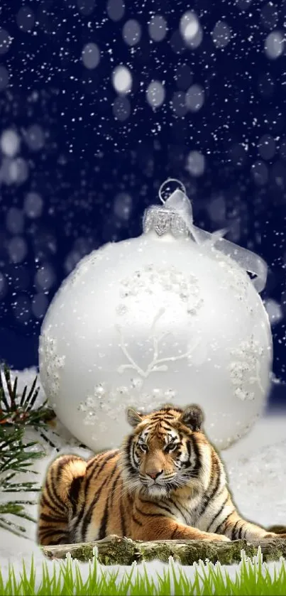 Tiger in snowy scene with Christmas ornament.