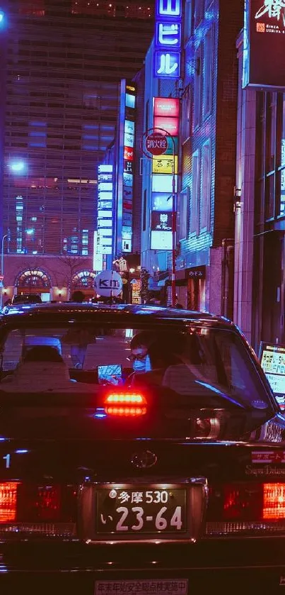 Tokyo street at night with neon lights and taxi.