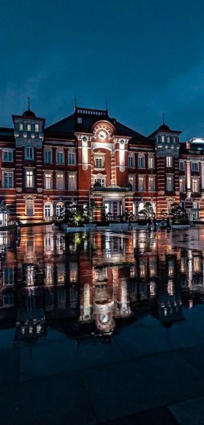 Night view of Tokyo Station reflected beautifully in water.