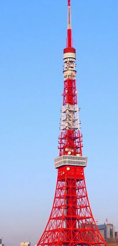 Tokyo Tower with a bright blue sky backdrop.