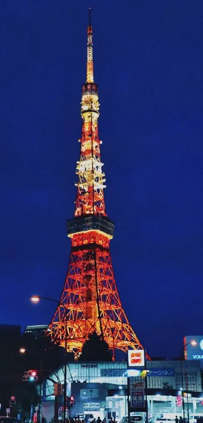 Tokyo Tower brightly lit against night sky.