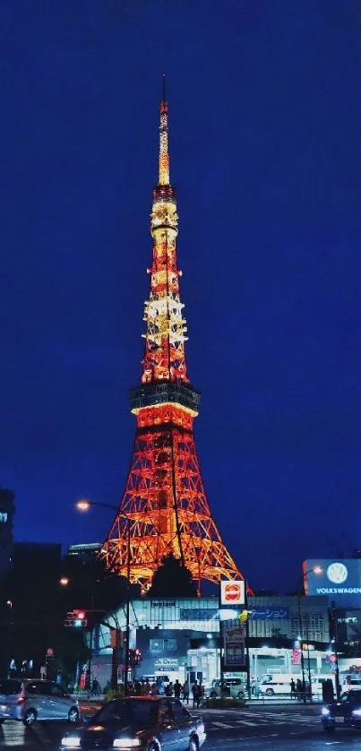 Tokyo Tower lit up against a dark sky at night.