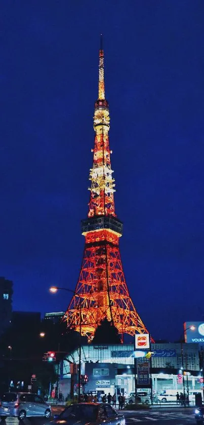 Tokyo Tower glowing at night against the deep blue sky, capturing vibrant city life.