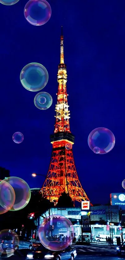 Tokyo Tower illuminated against a deep night sky with city lights below.