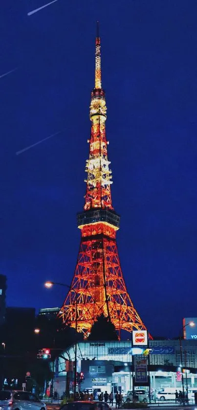 Tokyo Tower glowing at night against a deep blue sky.