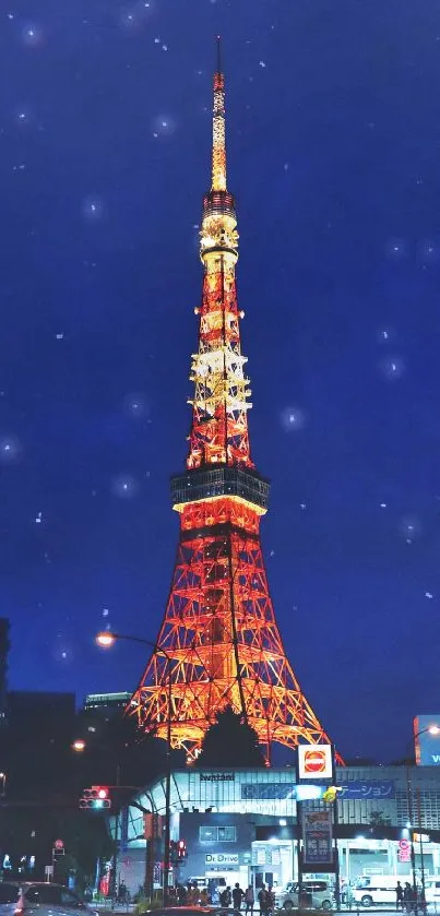 Tokyo Tower illuminated against a dark blue night sky filled with stars.