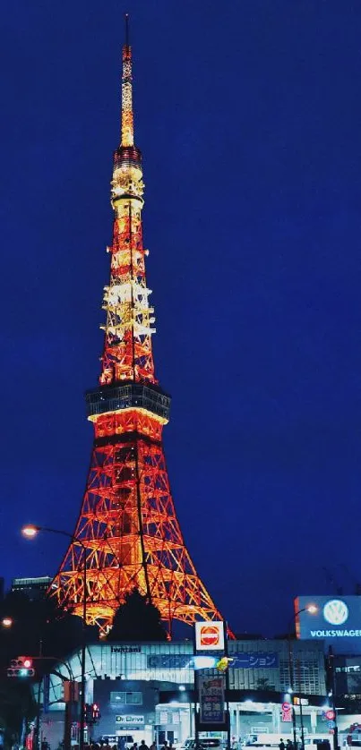 Tokyo Tower illuminated at night in vibrant colors.