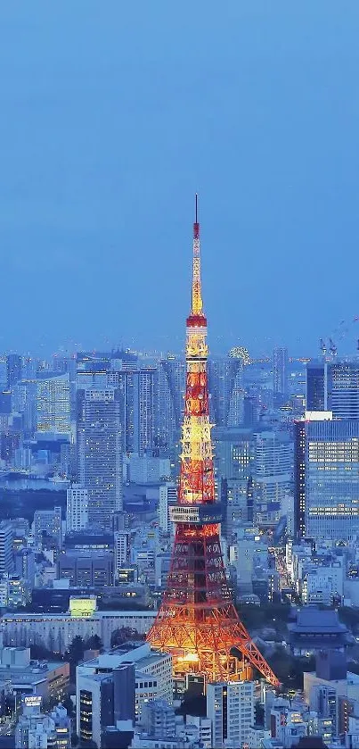 Tokyo Tower illuminated at night with city skyline.