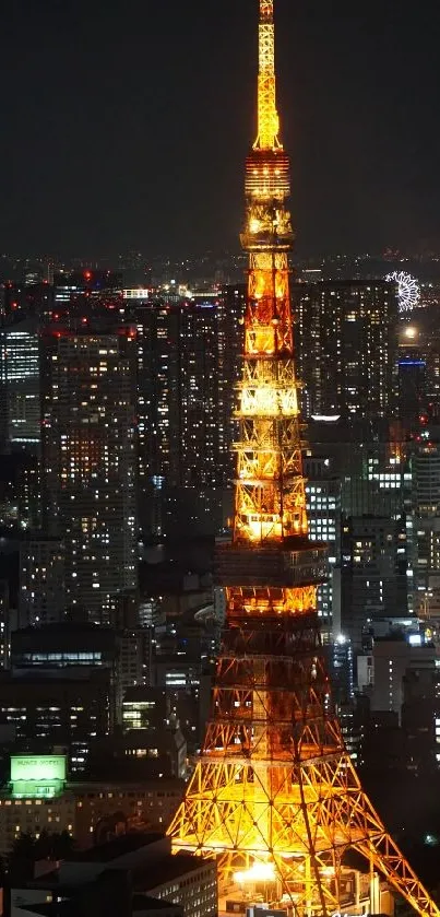 Tokyo Tower lit up in a cityscape at night.