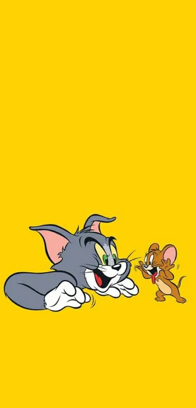 Tom and Jerry cartoon on yellow background wallpaper.