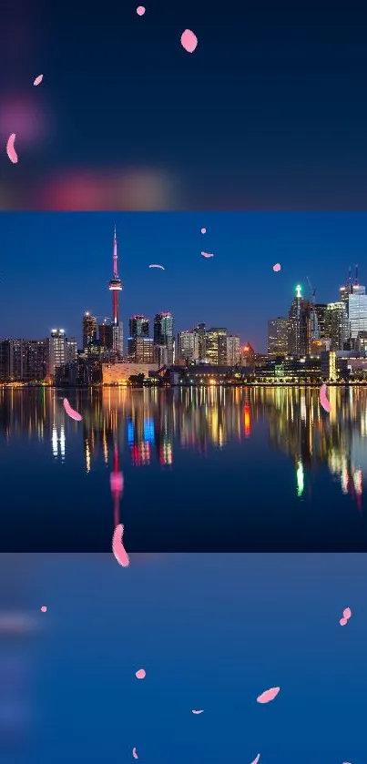 Toronto skyline at night with city lights reflecting on the lake.