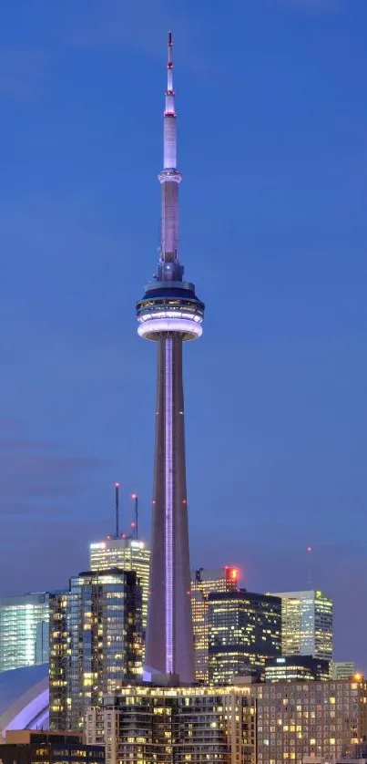 Toronto skyline at night with CN Tower and city lights.