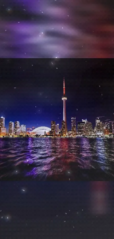 Toronto skyline at night with city lights and reflections on water.