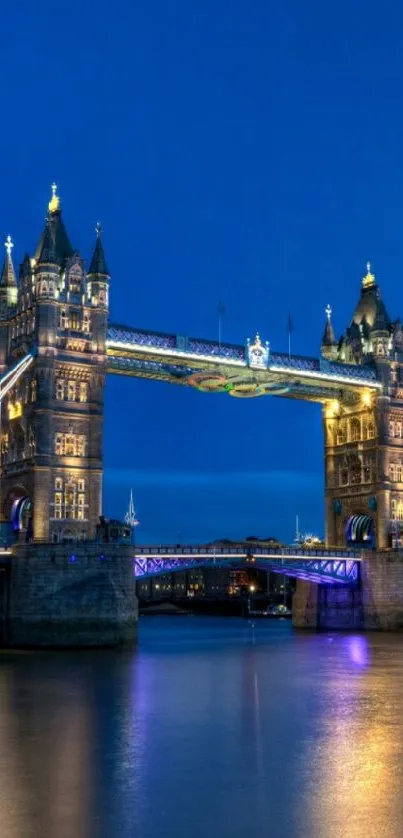 Tower Bridge beautifully illuminated at night over the Thames.