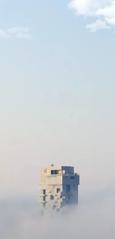 Lone tower amid soft mist with a clear sky.