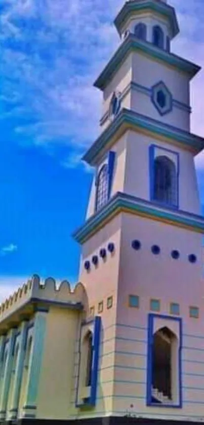 Elegant white and blue tower under a vivid blue sky landscape.