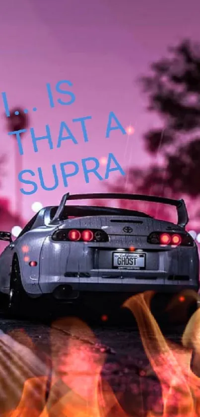 Toyota Supra on city street at night with vibrant pink lights.