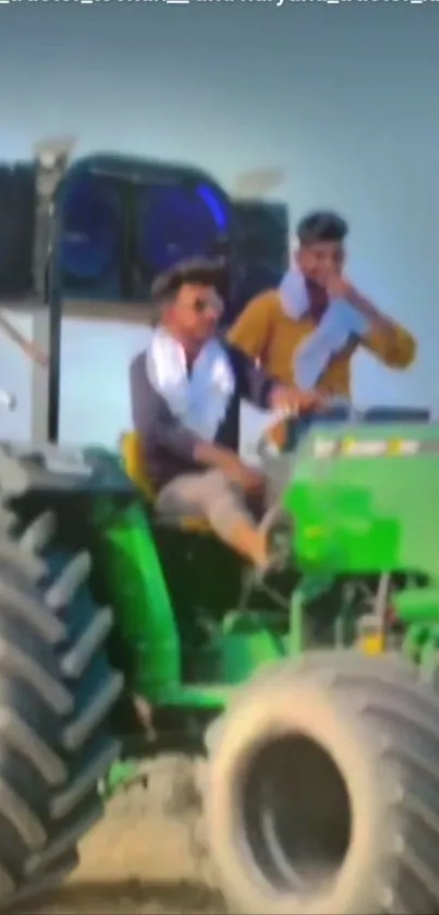 Men riding a green tractor in a scenic outdoor setting.