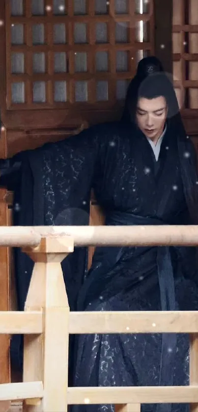 Asian warrior in traditional black robe by a wooden structure.