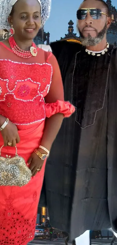 Couple in traditional attire standing in an urban city setting.