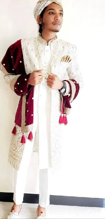 Man in ornate traditional attire with rich colors.