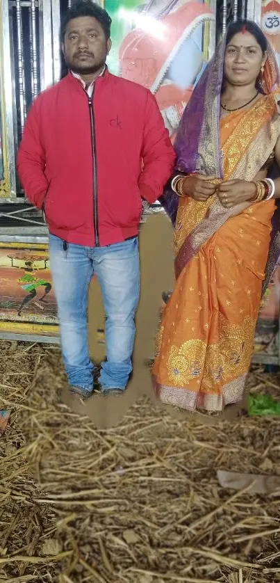 Traditional couple in vibrant attire with colorful and cultural background.