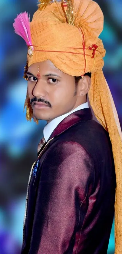 Elegant man in traditional Indian attire on a vibrant background.