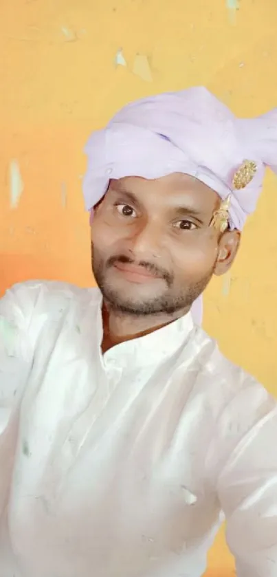 Man in traditional attire with yellow background.