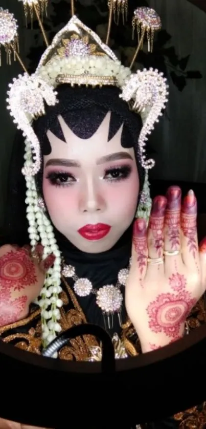 Traditional bridal beauty with henna design and elegant attire.