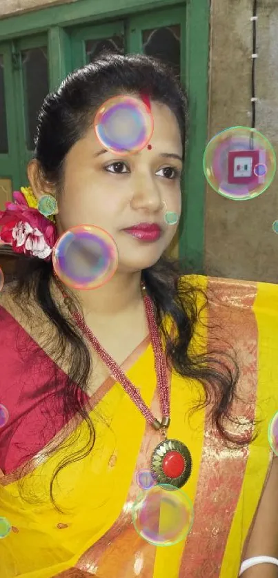 Indian woman in yellow and red saree portrait.