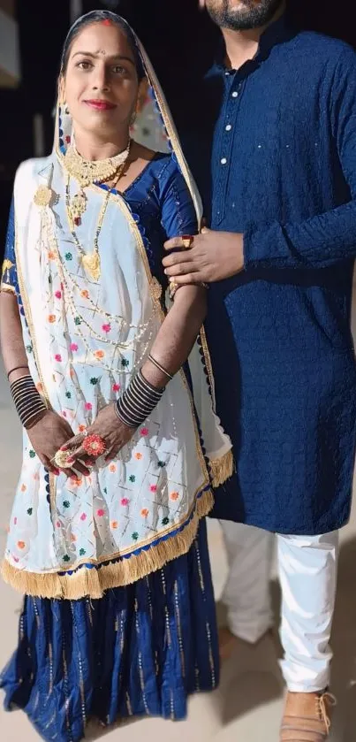 Couple in traditional Indian attire for a festive occasion.