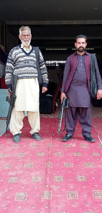 Two men in traditional attire standing confidently.