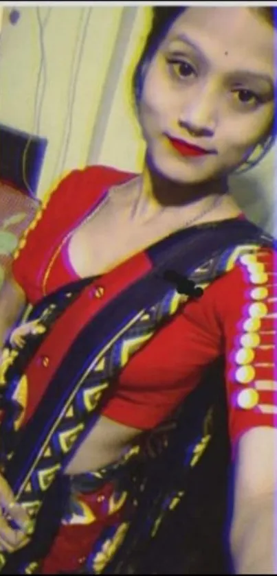 Woman in traditional Indian attire with red and black colors.