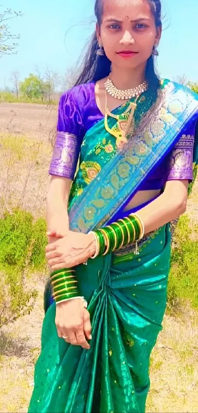 Woman in vibrant green saree standing outdoors.