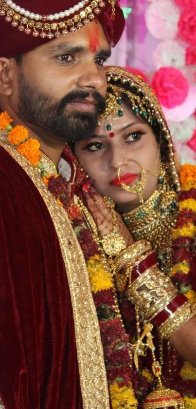 Indian wedding couple in traditional attire with vibrant colors.