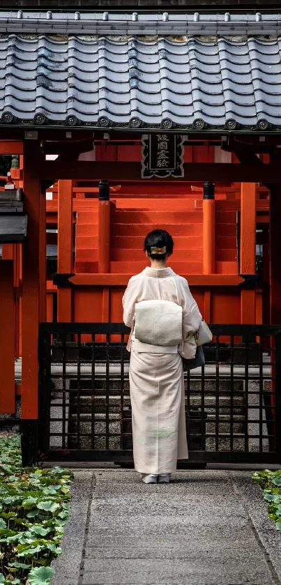 Japanese woman in kimono at red temple gate wallpaper.