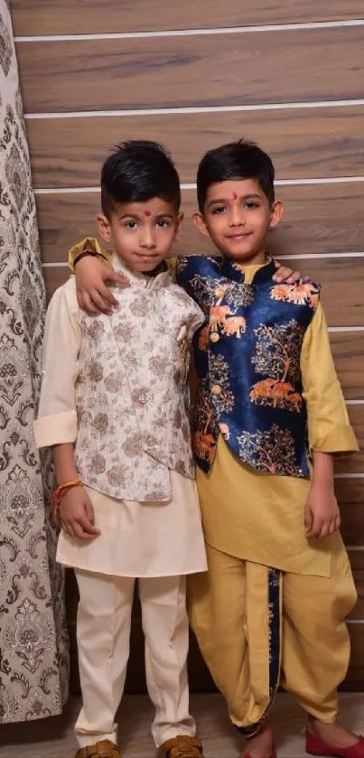 Two children in traditional outfits with rich patterns.