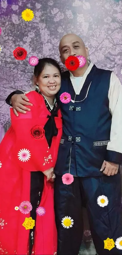 Couple in traditional Korean attire with cherry blossom backdrop.