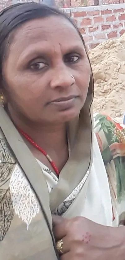 Traditional portrait of a woman with elegant scarf in outdoor setting.