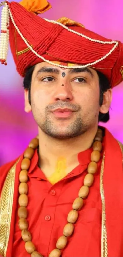 Man in traditional red attire with vibrant background.