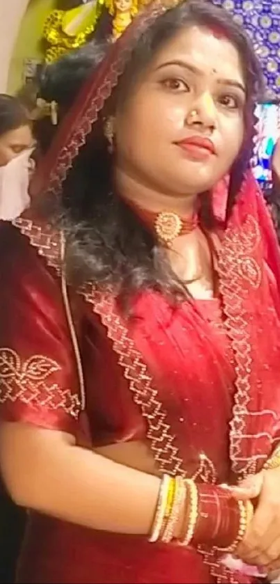 Woman in a traditional red saree portrait.