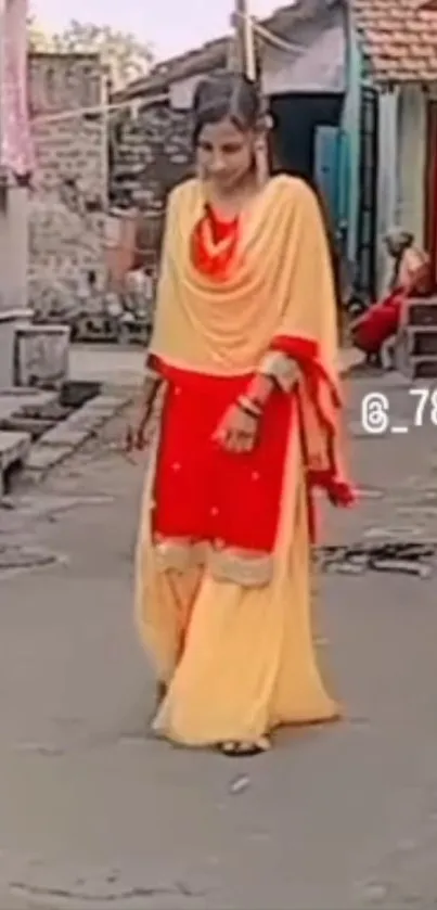 Village woman in yellow and red traditional attire.