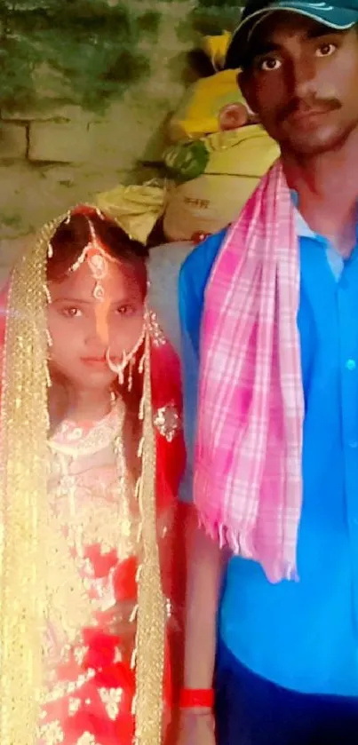 Traditional wedding portrait of a couple with vibrant attire.