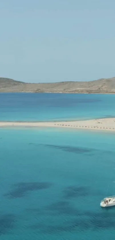 Tranquil beach view with sailboat and turquoise waters.